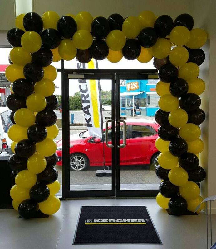 Black and yellow balloon arch decoration for shop or event